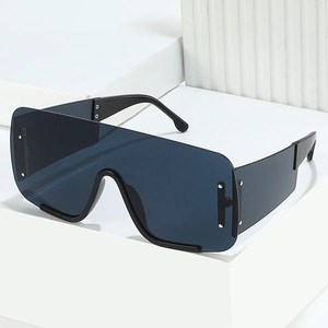 Oversized shield sunglasses with dark blue lenses and black temples on white display