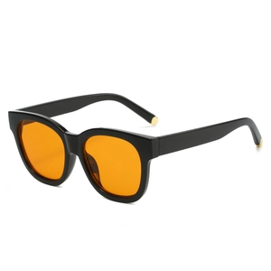 Retro oval sunglasses with glossy black frames and bright orange lenses for a vintage look