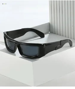 Close-up of black futuristic sports sunglasses on minimalist geometric display