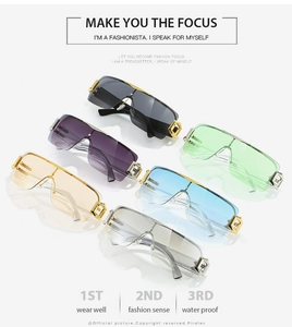 Detail view of colorful frameless Y2K sunglasses with gold geometric hollow hinges