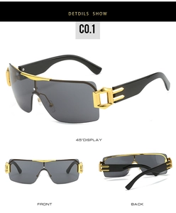 Macro detail of Y2K sunglasses featuring gold metal cut-out accents on black temples