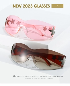 Detail of Y2K star-accented oversized sunglasses in pink and brown with anti-blue light lens