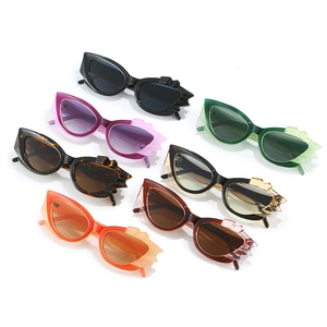 Cat eye crystal sunglasses set featuring seven assorted colors and flame-edged frames