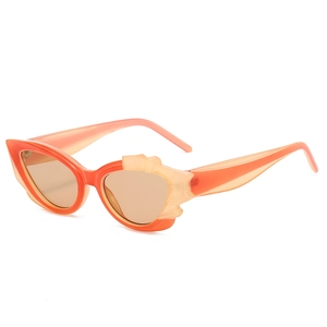 Cat eye sunglasses with orange gradient frames and 3D winged side details