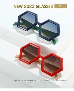 Macro detail of hexagonal frames showing contrasting blue and red oversized sunglasses