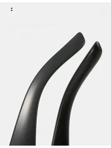 Detail of curved ergonomic temples in matte and glossy black finish for Y2K sunglasses
