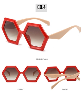 Detail view of red hexagonal oversized sunglasses with gradient lenses and beige temples