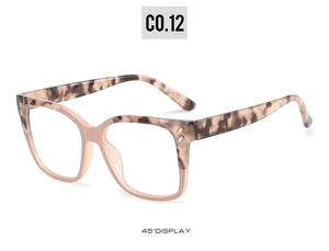 Detail view of pink tortoiseshell square eyeglass frames with silver rivet accents at 45 degrees