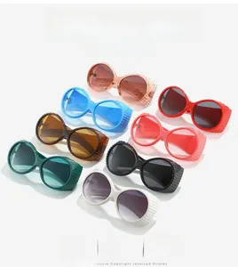 Macro shot of oval vintage sunglasses showing thick striped side shields in eight colors