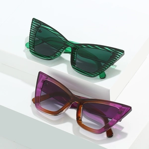 Fashionable cat eye sunglasses in green striped and purple gradient frames for women