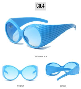 Close-up of bright blue oval sunglasses featuring distinctive ribbed temple design details