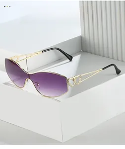 Detail of gold metal temples with double hollow heart design and purple gradient lenses