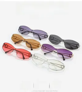 Detail of rimless heart-shaped sunglasses in multiple colors with metallic frames