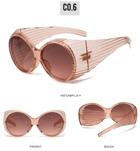 Detailed views of vintage oversized oval sunglasses in translucent peach with striped temples