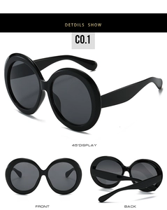 Detailed views of black oversized round sunglasses from front, back and side angles