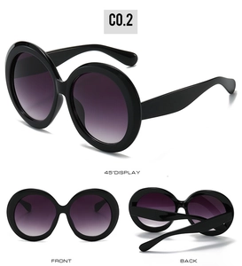 Detailed views of round oversized sunglasses with black frames and purple gradient lenses