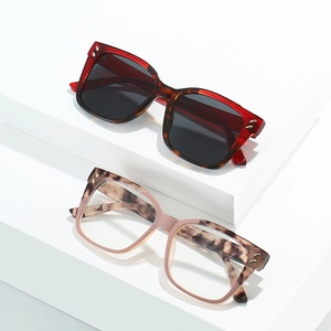 Fashionable oversized square sunglasses and clear lens frames with rivet detail