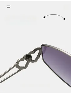 Detailed macro view of durable silver metal hinge with hollow double heart design on sunglasses