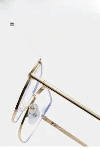 Detailed close-up of flexible hinges and gold metal frame on anti-blue light glasses