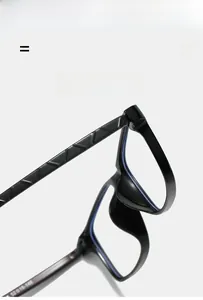 Macro detail of black square frame glasses showing geometric relief pattern on temples