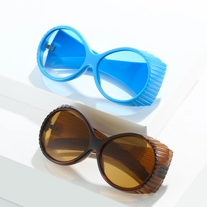 Retro oversized oval sunglasses featuring side stripe windproof frame in blue and brown