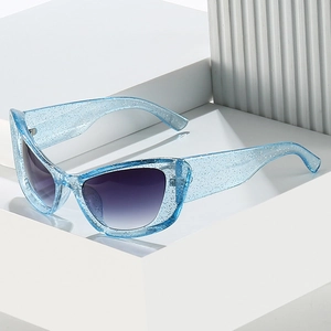 Cat eye sunglasses with light blue glitter frames and gradient purple lenses