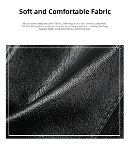 Macro shot of soft black faux leather with lychee texture and stitching detail