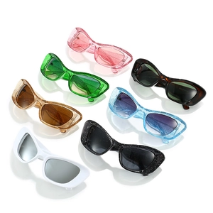 Oversized cat-eye sunglasses with colorful glitter frames in a variety of vibrant colors