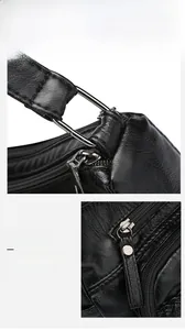 Close-up of black litchi pattern leather bag showing silver metal zipper and hardware