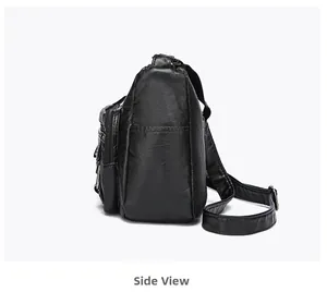 Side view of black lychee grain leather crossbody bag showing multi-layer zipper pockets