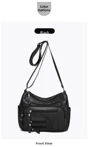 Front view of black multi-zipper shoulder bag with woven details and side pockets