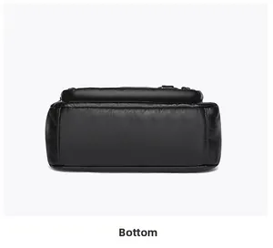 Detail view showing the reinforced rectangular bottom of a black leather shoulder bag