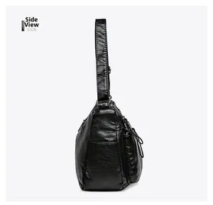 Side view of soft black leather shoulder bag with side zipper and matte metal hardware
