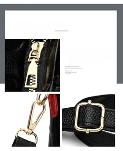 Macro detail of light gold hardware and textured black lychee grain leather on tote bag