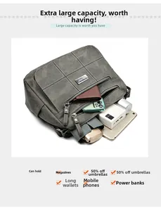 Top view of large capacity grey crossbody bag showing internal compartments and essentials