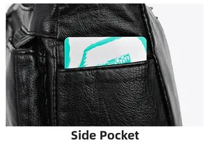 Detail of the side pocket on a black litchi pattern bag with a soft leather texture