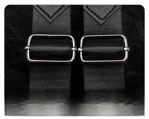Detail of adjustable nylon shoulder strap with metal ring and leather reinforcement