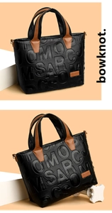 Detail of lychee pattern leather tote bag with embossed letters and caramel contrast strap