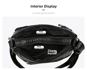 Detail view of the multi-compartment interior and zippered pockets of this soft leather bag
