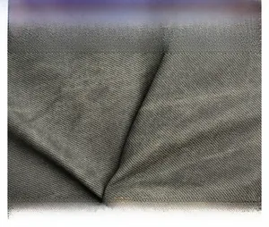 Macro shot of durable dark grey-green twill fabric with textured detail on women shoulder bag