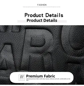Detailed view of black pebble grain leather featuring embossed stylish letter patterns