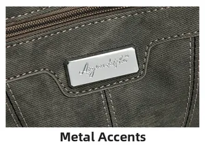 Detail of silver metallic logo plate on high-quality gray twill fabric crossbody bag