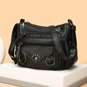 Multi-pocket black soft PU leather shoulder bag for women with silver metal rings and rivets