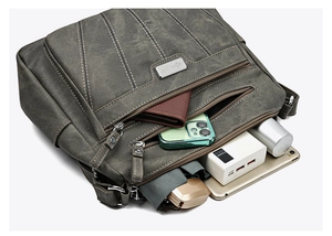 Detail showing high-capacity gray crossbody bag with multiple pockets and daily essentials