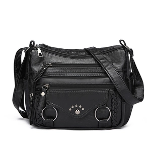 Black multi-pocket soft leather shoulder bag with four front zippers and rivet details