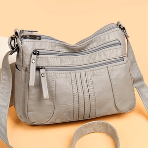 Minimalist grey faux leather multi-pocket crossbody bag with soft lychee texture