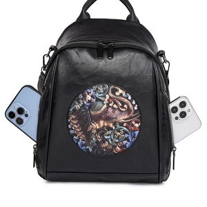 Versatile black leather backpack with ethnic elephant patch and dual side phone pockets