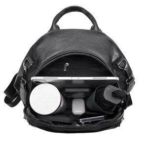 Versatile black faux leather backpack showing large capacity and multi-pocket interior