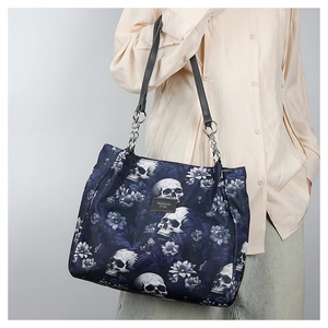 Close-up of gothic skull print tote bag with silver chain straps and large capacity
