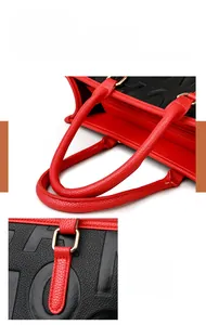 Détail de la poignée rouge et ferrures dorées sur le sac cabas texturé
